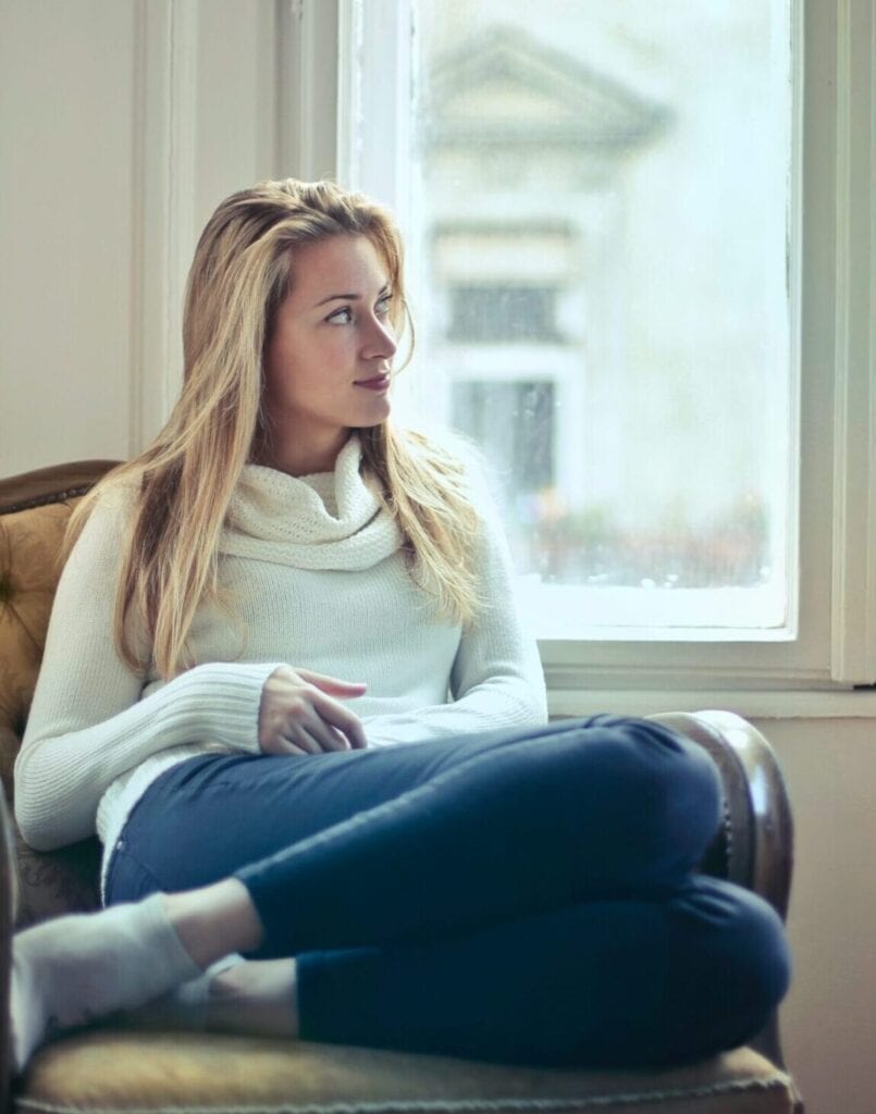 Blonde woman female veteran relaxes for her mental health after appointment with Telemedica telemedicine services