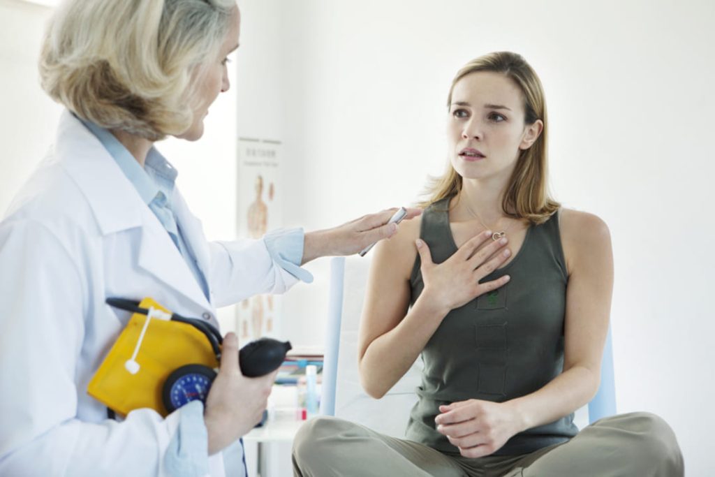 Woman talking with her doctor.